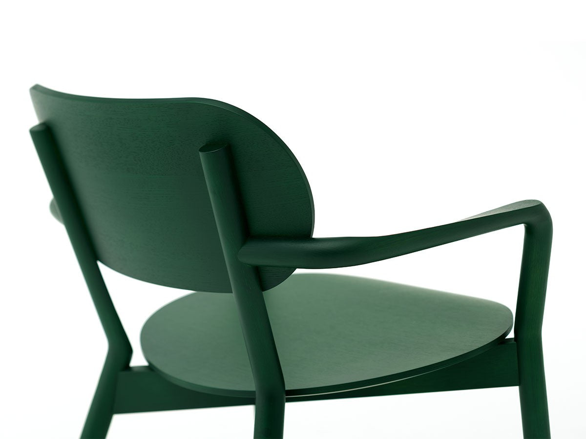 Fauteuil bas Castor — détail du dossier galbé et de l'accotoir cintré, en vert foncé | Antifer