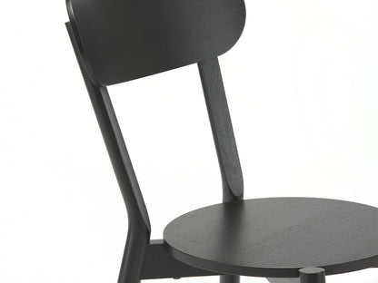 Chaise Castor — détail du dossier galbé noir et de l'assise ronde | Antifer