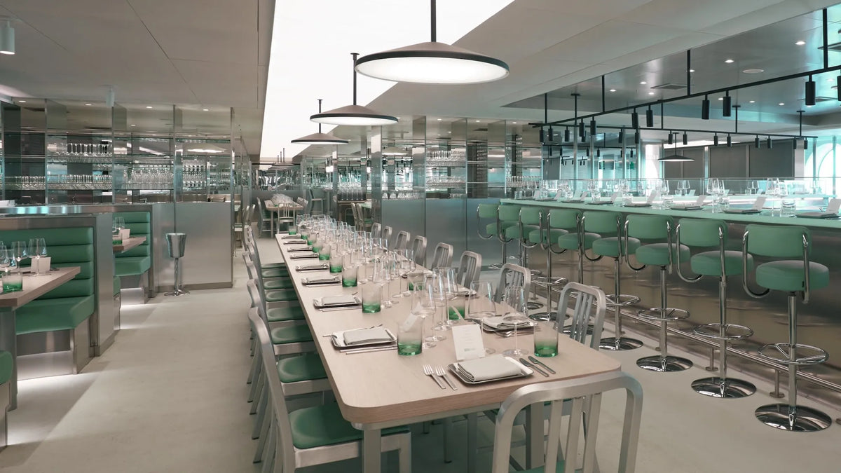 Emeco 1006 Navy chair at the Test Kitchen restaurant, Virgin Voyages — brushed aluminium in situ | Antifer