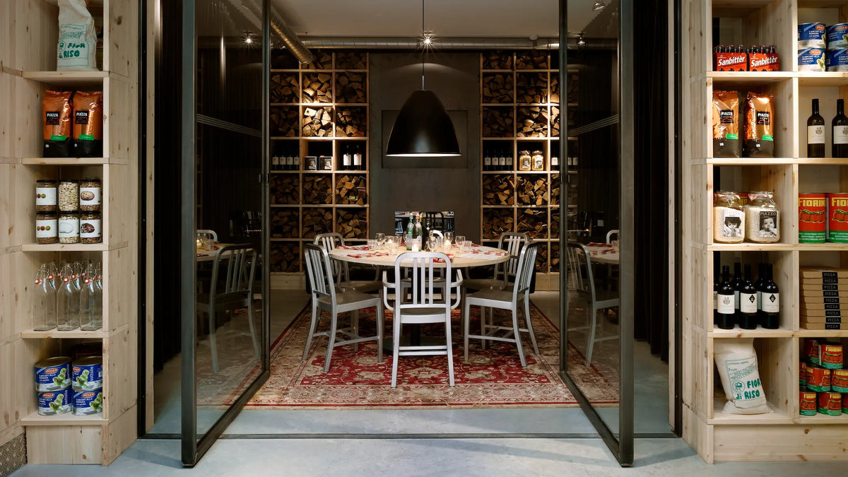 Emeco 1006 Navy at the Mazzo restaurant, Amsterdam — brushed aluminium in situ | Antifer