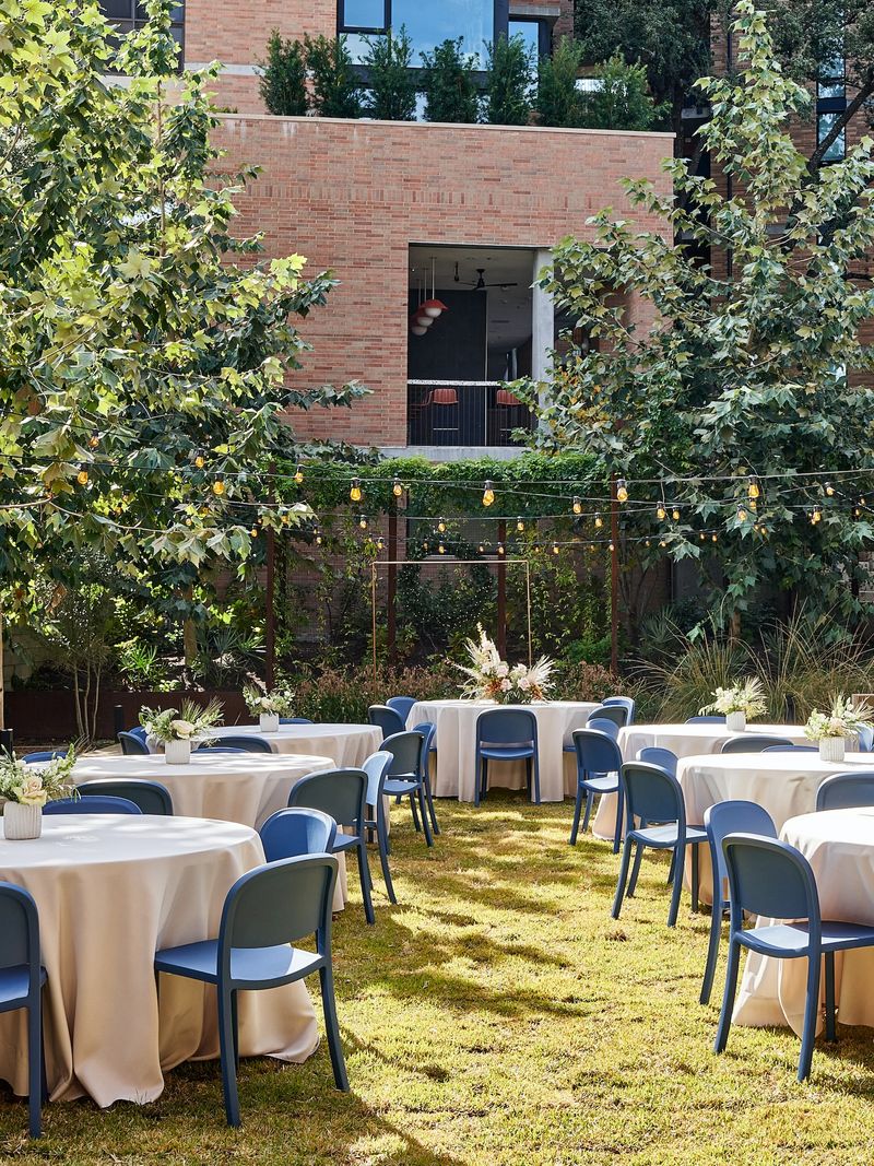 Event space at the Magdalena Hotel with Emeco furniture — Navy aluminum chairs on terrace