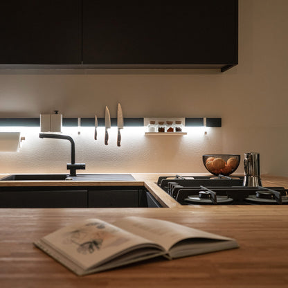 Variand I02 wall shelf, small, in situ — birch with a book — design Variand | Antifer